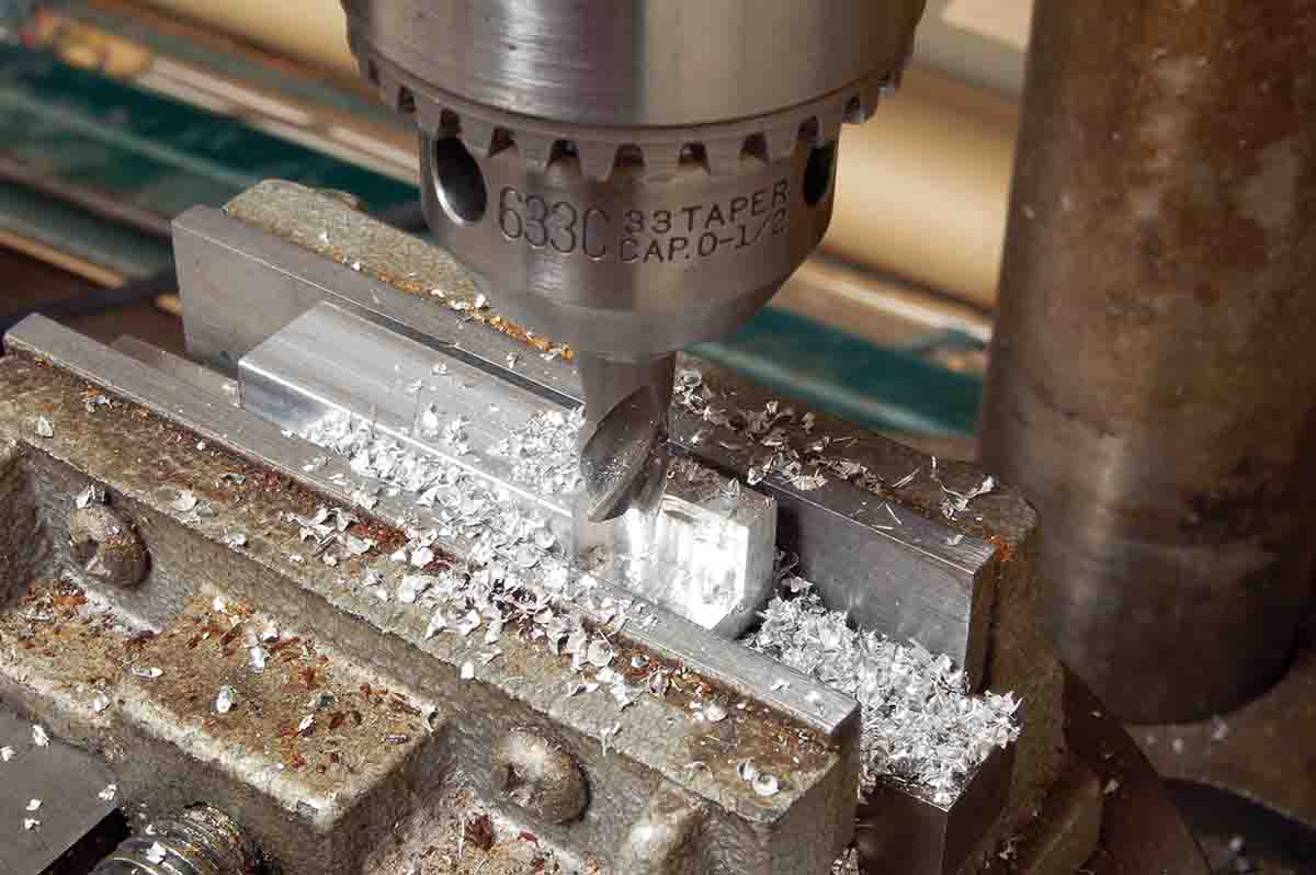 The Picatinny base stock is too tall, but can be thinned by “plunge milling” in a drill press using cheap end mill.